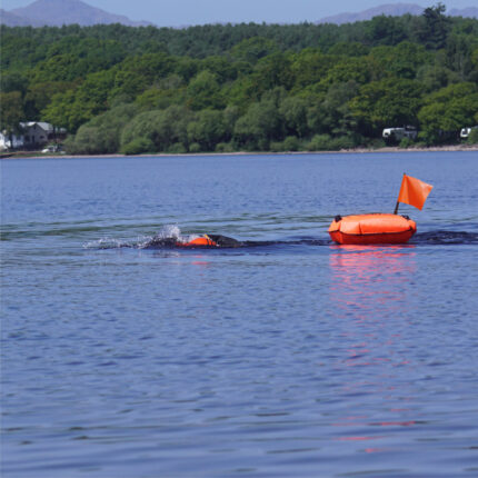 Dry Bag Swimming Tow Float with Flags in use