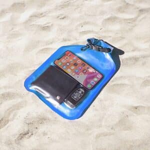 Flat Dry Bag with Viewing Window - Blue on a beach
